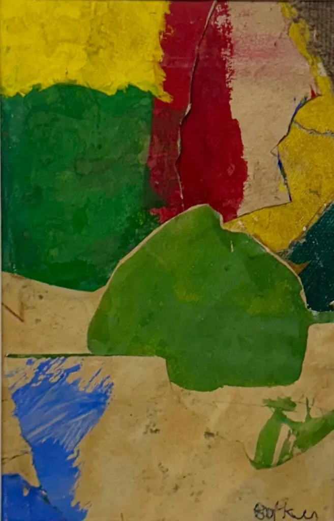 Abstract painting with bold patches of yellow, red, green, and blue on a tan background. The shapes have rough, jagged edges and overlap, creating a textured, layered look. The artists signature appears in the bottom right.
