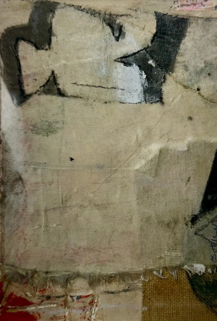 Abstract artwork featuring a rough canvas with frayed edges, patches of beige, black, and white paint, and textured layers. Some areas display dark brushstrokes, while faint red and blue lines appear near the bottom and edges.